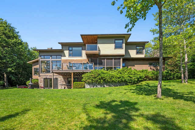 Modern lakehouse living room with waterfront views